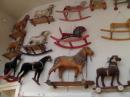 A whole wall of rocking/rolling horses