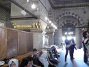 The New Mosque: Prayer meeting in progress  -women worship behind screens on the left