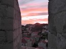 Dubrovnik: Picture postcard sunset through the rampart.
