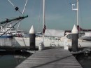 Libertad on the outside of the furthest out dock, resting peacefully with sun shade/rain catcher doing double duty quite effectively
