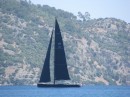 Gulf of Fethiye, Turkey.  Unique to see both the sails and hull of a yacht black.