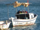 An afternoon somewhere in Turkey...gentleman lying on top of the boat sleeping in shade 