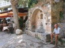 Trevor sitting at fountain in Agios Nikolaos