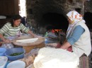 Turkish women making gozleme (pancake) stuffed with cheese, potatoes &/or spinach... a common menu item.