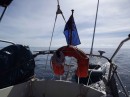 Towing the dinghy for the first time. Flat seas over 18nm.