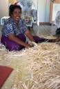 Maria - hand weaving a large floor mat from dried Pandanis leaves