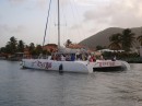 The booming sound of reggae announces the return of big sailing catamarans such as the "Mango Tango", packed with hotel guests or cruise ship passengers