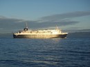When sun glinted off the hull of a ferry, we were amused to be able to discern the painted-out name Caledonian McBrayne