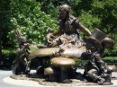 A bronze statue of characters from Alice in Wonderland