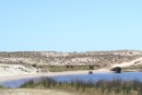 Sand Dunes behind beach with tidal lake