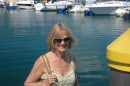 Judy on the pontoons in the marina at Cangas.