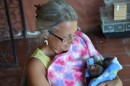Me holding the newborn sloth - she or he was very cute