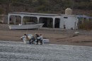 Fisherman always working, here they are loading ice by hand to keep the catch cool until it can be transported