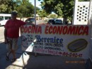 Reg beside the sign for the Cocina
