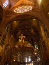 The inside of the catedral in Palma. Gaudi made the iron candle sculpture on the altar.