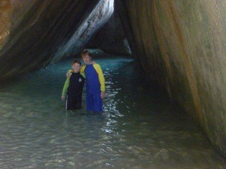RJ & Leo walking through the Baths, caves formed by volcanic rocks with pools throughout.