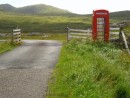The classic red phone box next to a cattle grid on Barra.