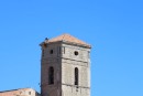 Workmen doing repairs to bell tower in La Coitat, France