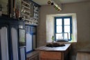 Traditional Breton farmhouse.  This is the "fancy room" or parlor although it looks almost identical to the one that is used as the kitchen.  A fireplace is behind the 2 doors at the left