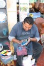 New level of finger painting at Ensenada!: Ensenada: Finger painter made beautiful paintings on plates.