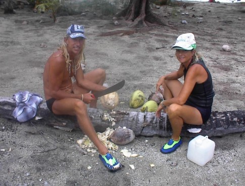 Claude and Ronel preparing dinner , making coconut milk for the fish