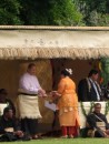 She receives an award from the King
