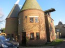 An oast house, where hops was dried, converted to homes
