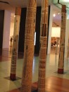 Burial sticks in the Victoria Gallery.  Each holds the bones of a relative and is painted with their story