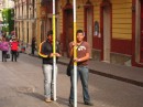 Two university students learning to survey on the street outside our hotel