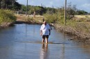 George Brooks investigating the flooded road to see if it would be possible for us to drive through..........