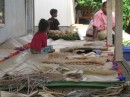 Lapi Island residents displaying weaving work for tourists.