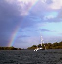 "Blue Lagoon" - Kevin & Chris Phillips - under a lovely rainbow at Bribie Island. June 2012