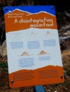 This sign explains the origin of Black Mountain. The boulders here are darker than those on Cape Melville because of the lichen greowing on them.