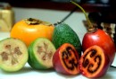 Fall fruits persimmon (light orange), feioja (green), tamarillo (red).  All delicious.