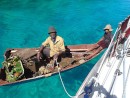 The Tongan villager arrives with coconuts and plantain at our mooring at Tapana Island