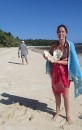 Lara with giant clam shell found on the beach of Taunga Island