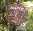 We drove our rental car up a dirt road for about 2 miles just to find this!!...  Things are truly different here, this sign, leaning against a pile of cinder blocks was all there was to find Riverrock Falls.  if the sign was a disappointment, guess what.... so were the falls.  Oh well, ya win some and you loose some, we continued on.