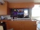 42" Samsung TV suspended on 2 x Al 50 mm x 3mm angle attached to rear of overhead cabinet.