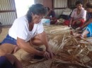 Michelle learning a new trade.  On Mondays the village women get together to weave new mats for flooring or send to the craft market in Suva.