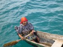 Kuna women in her dugout canoe