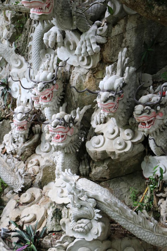 Figures carved into the mountain wall