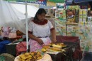 Street vendor selling roasted corn for snacks,  a popular item