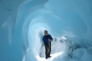 Ice tunnels form when the faster moving ice up high pushes into the slower moving ice lower down.  Although the upper glacier moves at up to 5 feet per day the lower ice only moves about 1.  The face of the glacier retreat from melting faster the forward progress 