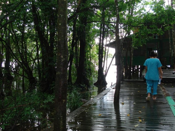 Walkway to the boys dorm,  built over the river.  They can often be seen jumping off the 2nd floor balcony into the river