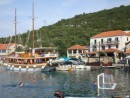 Polace, Mljet with water game in foreground and typical Croatian holiday guest boat at left