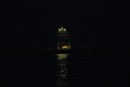 Prawn trawler sailing to work at night.