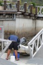 Sam putting rollers on dinghi at Blue Water Marina.