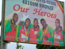 This billboard shows the Olympic medal-winning team from St. Kitts-Nevis.  
