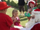 Handing out the presents at Safa Park to Ireland, Emerald and Bailey Knowles.