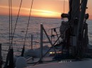 The sun setting as we prepare to turn south at Cape Reinga.  We picked up enough breeze to sail after rounding the Cape.